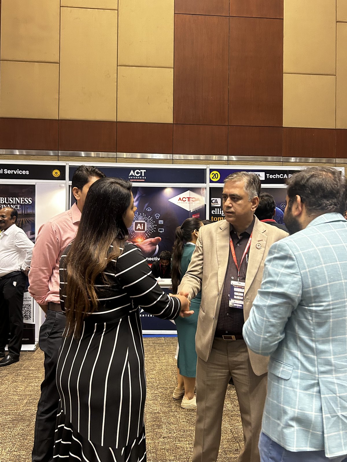 SecComply in conversation at an exhibitor booth, ICAI DxFS 2026
