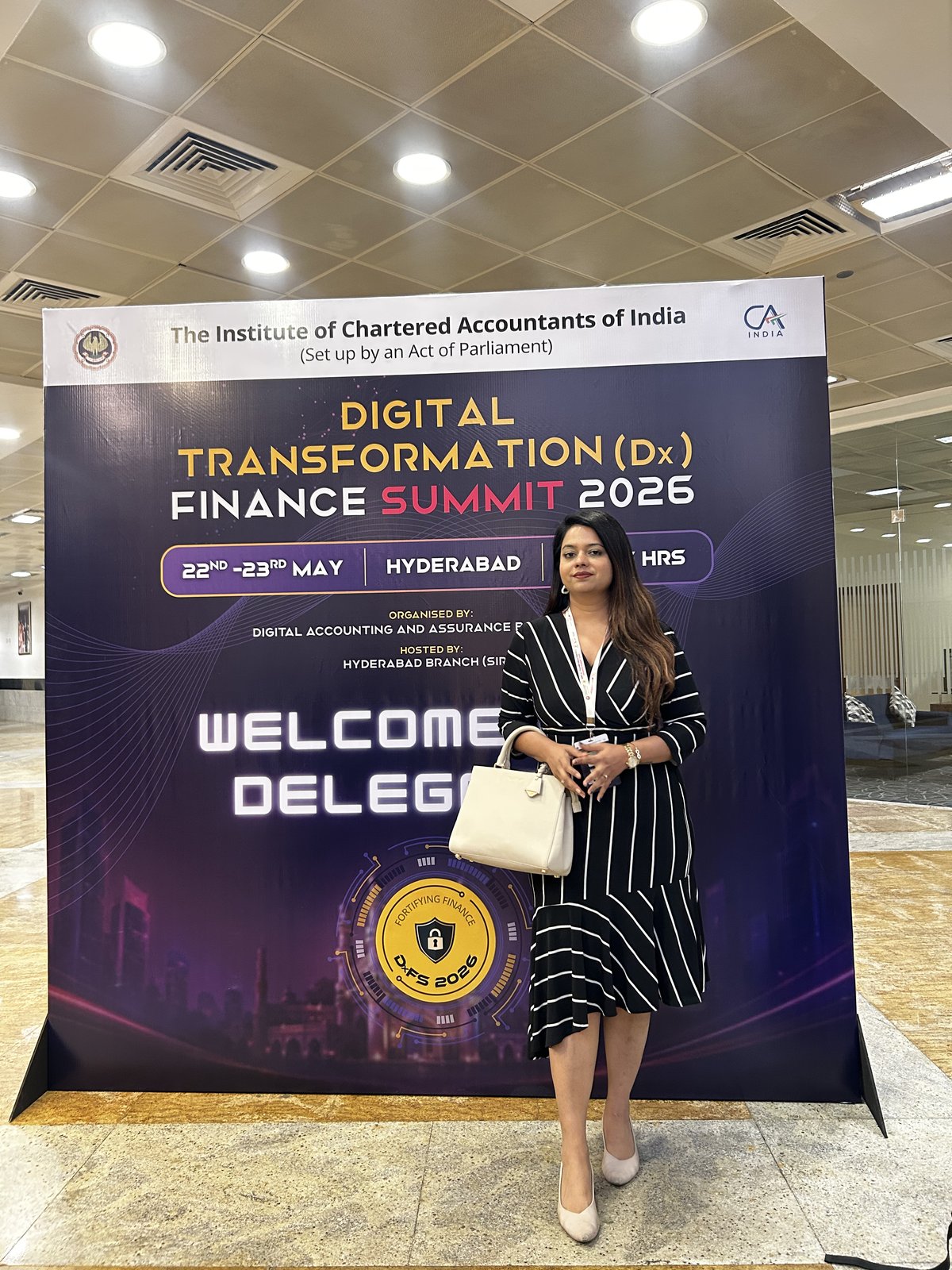 SecComply at the DxFS 2026 welcome backdrop, Hyderabad