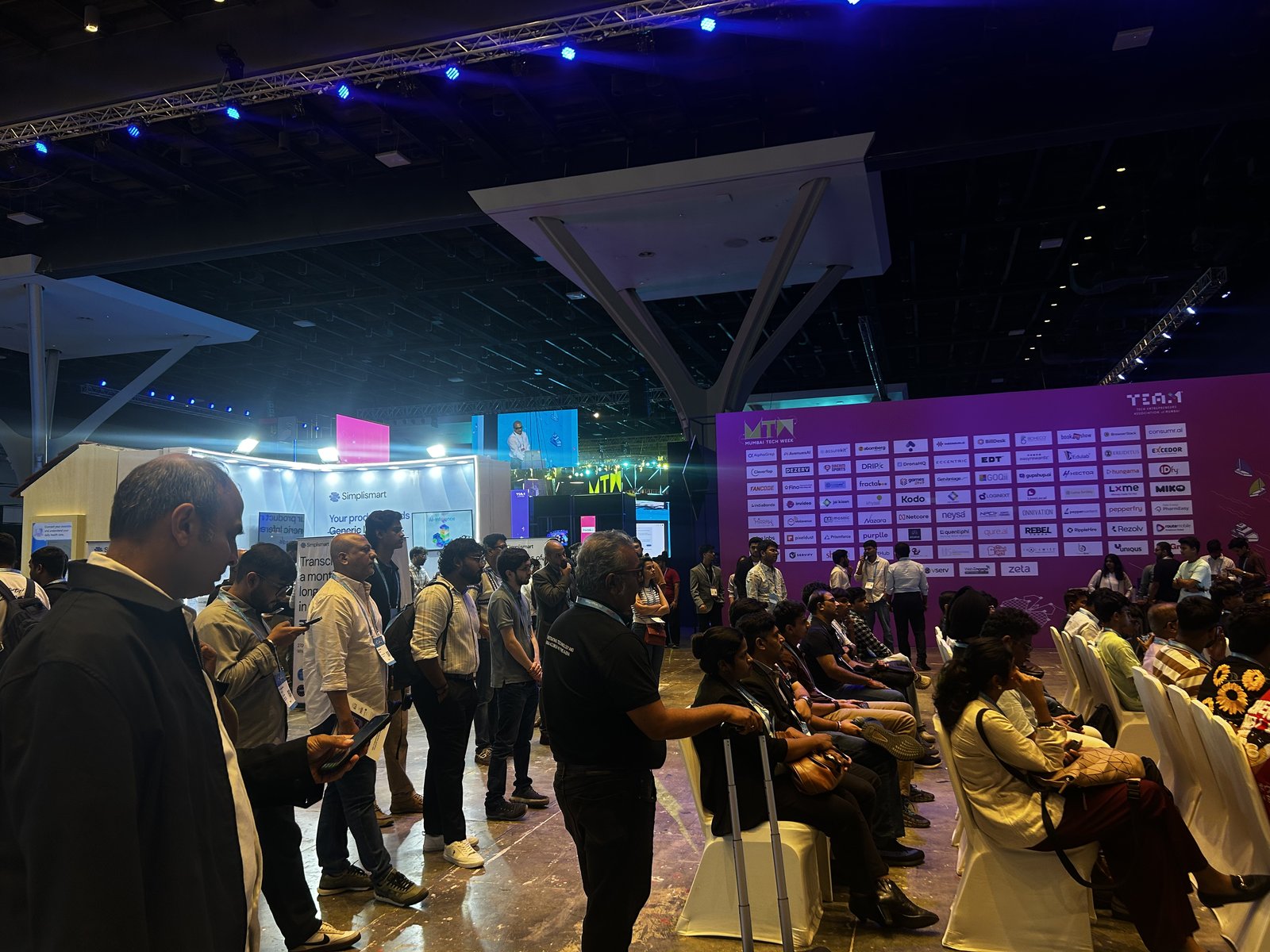 Delegates and the sponsor wall at a Mumbai Tech Week 2026 main stage