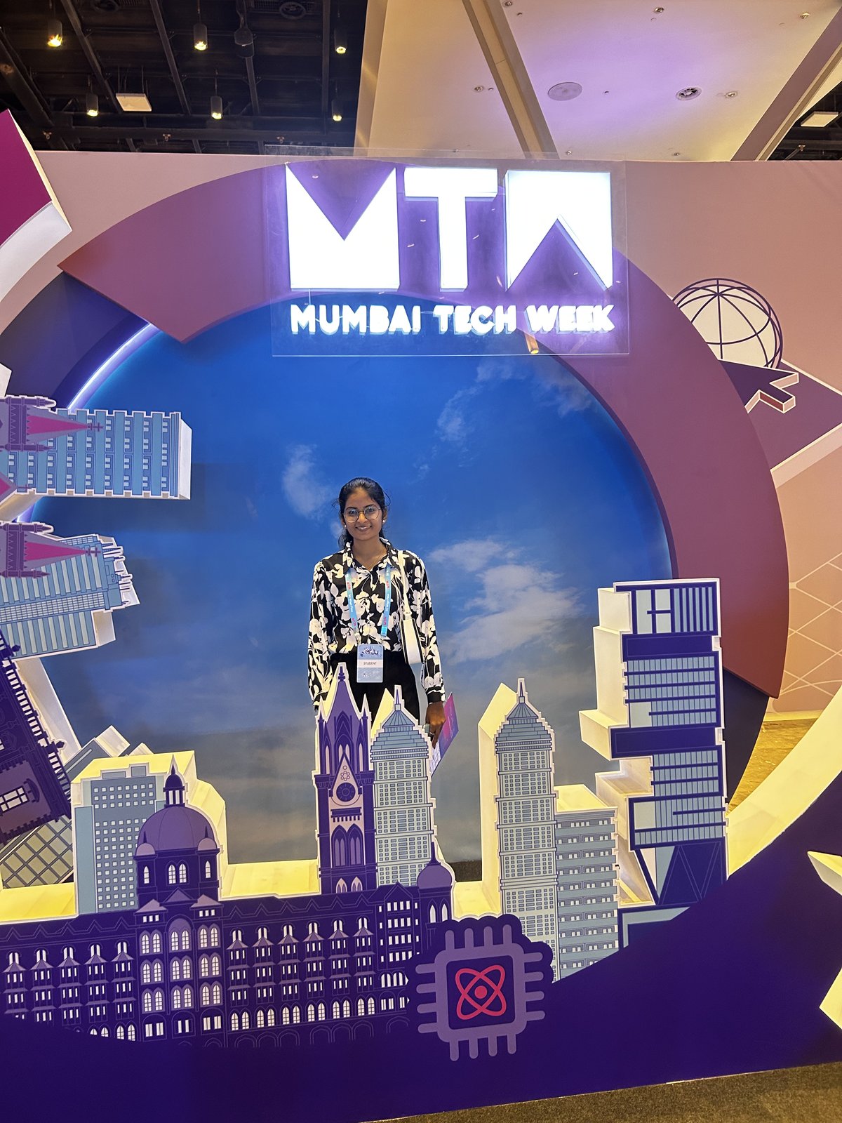 A SecComply team member at the Mumbai Tech Week 2026 skyline backdrop